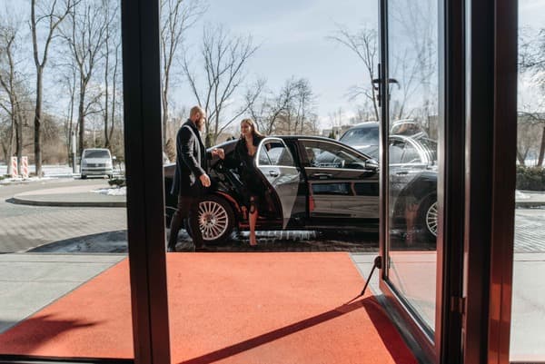 Celebrity leaving a car on red carpet