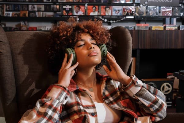 Girl with headphones listening to white noise