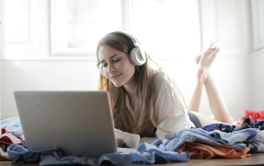 Person sleeping calmly with a sound machine nearby, illustrating sound therapy use during quiet times like sleep.