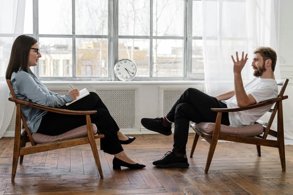 Person looking calm during a therapy session, symbolizing finding relief from the emotional impact of tinnitus.